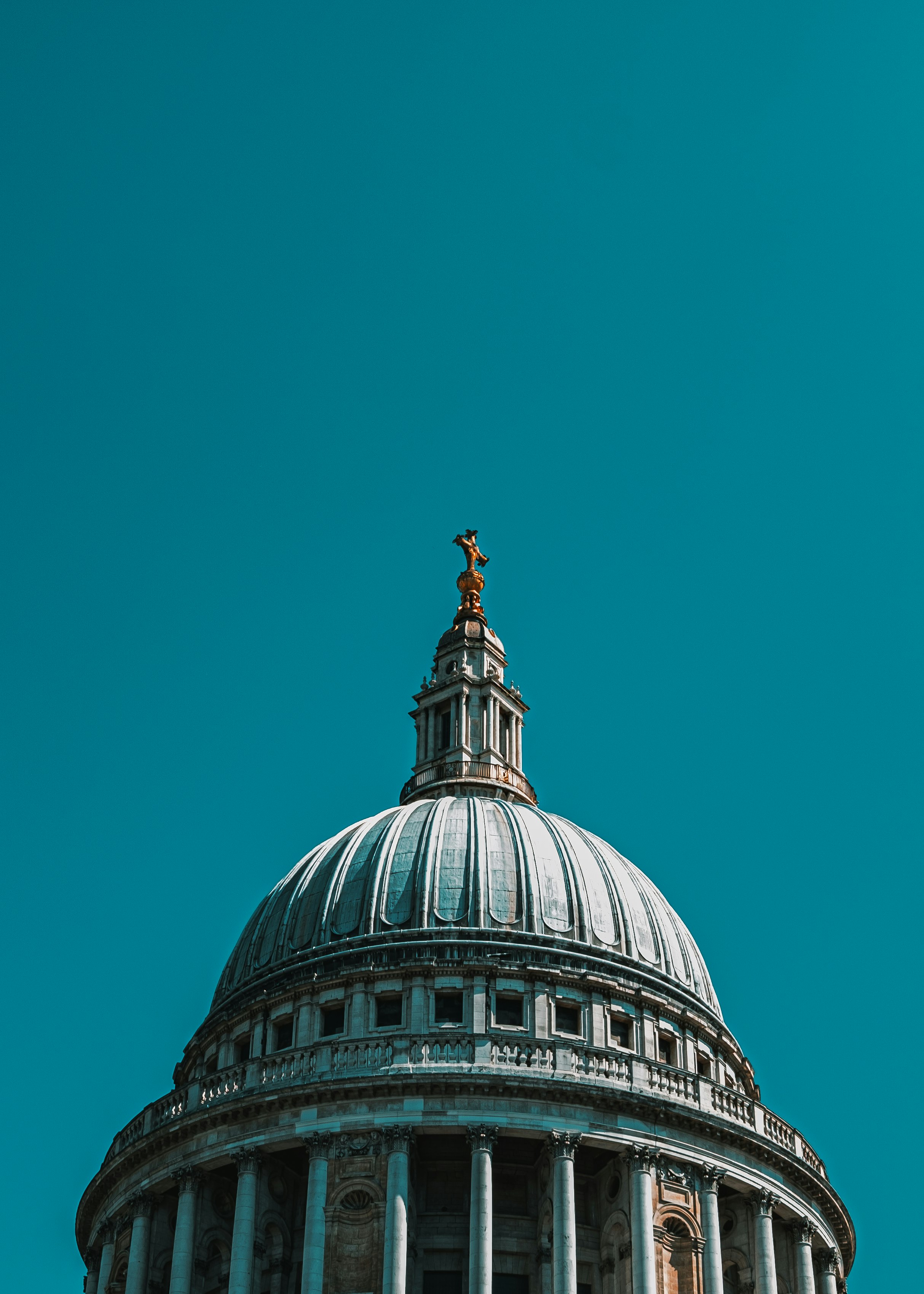 white and black dome building under blue sky during daytime